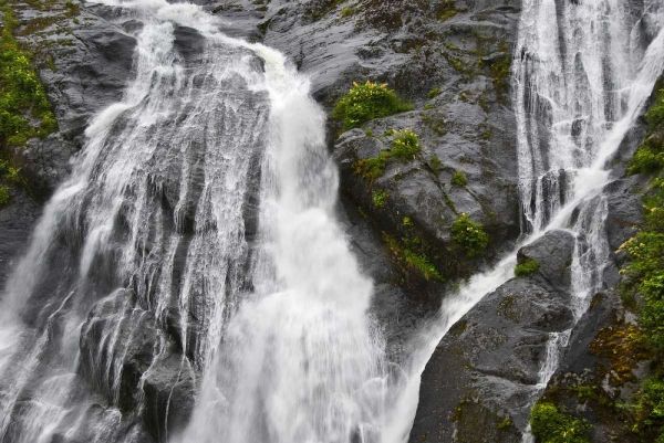 AK, Inside Passage Waterfalls rush down rock